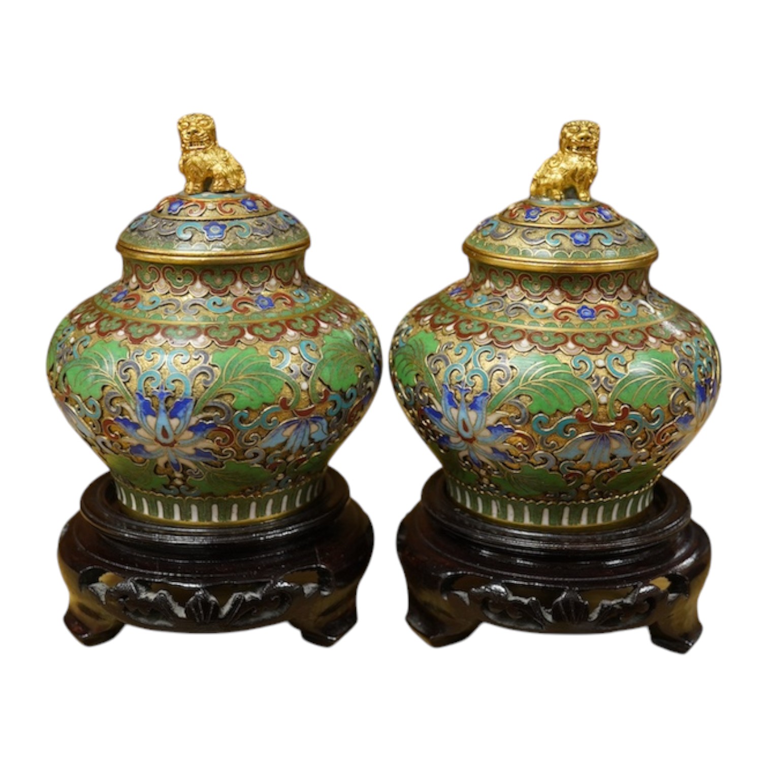 A pair of Chinese cloisonné enamel jars and covers on stands, 14cm high. Condition - good